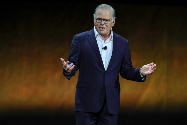David Zaslav CEO Warner Bros Discovery headshot official portrait" Caption: "David Zaslav, CEO of Warner Bros Discovery, prepares to reject Paramount's acquisition offer
