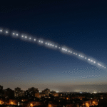 Starlink satellites forming a visible train in night sky