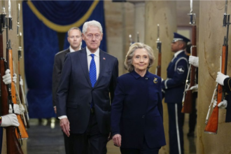 Bill Clinton and Hillary Clinton during public appearance amid Epstein investigation