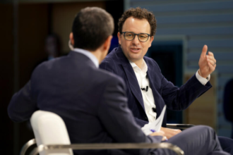 Anthropic CEO Dario Amodei speaking at conference amid Pentagon AI deal negotiations March 2026