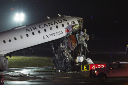 LaGuardia Airport crash Air Canada CRJ-900 Runway 4 Port Authority fire truck collision March 23 2026 nose damage tilted