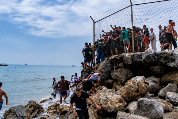 Ceuta migrant crisis showing migrants gathered near the Spain–Morocco border crossing