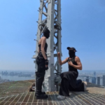 Empire State Building climbers 2026 Angela Nikolau Ivan Beerkus spire peace banner
