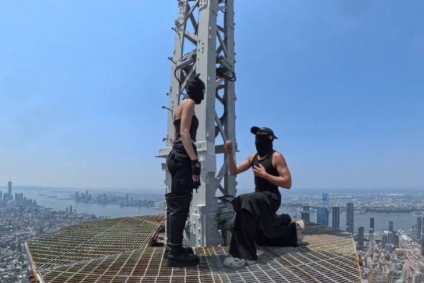 Empire State Building climbers 2026 Angela Nikolau Ivan Beerkus spire peace banner