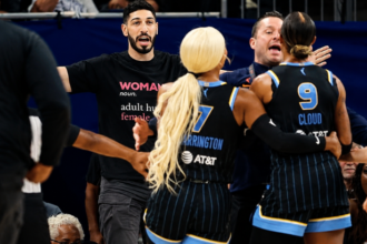 Enes Kanter Freedom being escorted from Fever vs Sky game