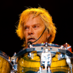Frank Beard playing drums with ZZ Top during a live performance