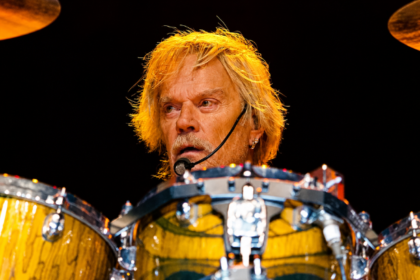 Frank Beard playing drums with ZZ Top during a live performance