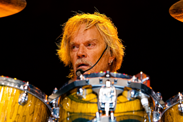 Frank Beard playing drums with ZZ Top during a live performance