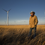 Pete Ferrell Kansas wind ranch with wind turbines across the Flint Hills