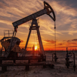 Oil pump jack representing Brent and WTI crude oil prices falling in global energy markets.