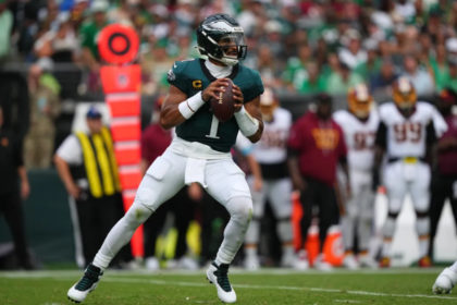 Commanders vs Eagles Jalen Hurts throwing a touchdown pass in Week 1