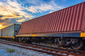 Cargo insurance and supply chain risk management illustrated by freight containers at a distribution terminal