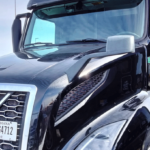 Logistics team managing a dedicated transportation contract with trucks and digital fleet tracking
