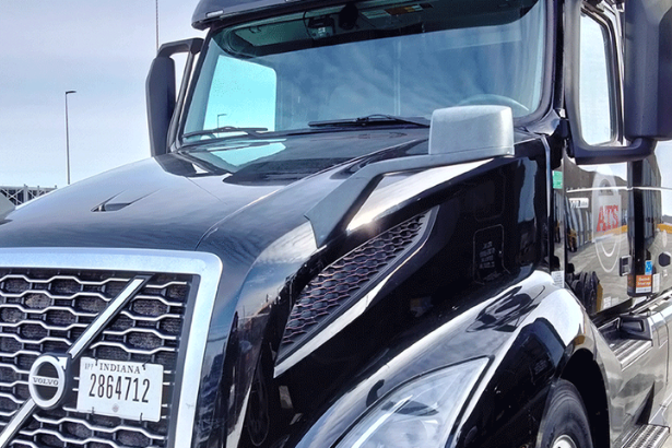 Logistics team managing a dedicated transportation contract with trucks and digital fleet tracking