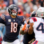 New England Patriots and Chicago Bears players compete during Thursday Night Football