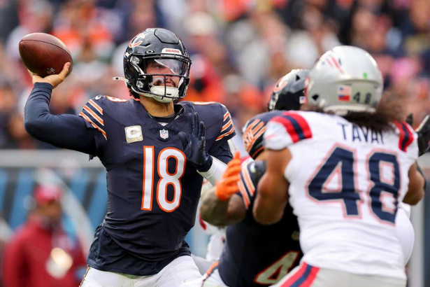 New England Patriots and Chicago Bears players compete during Thursday Night Football