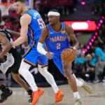 Shai Gilgeous-Alexander attacking the basket for the Oklahoma City Thunder against the Spurs