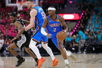 Shai Gilgeous-Alexander attacking the basket for the Oklahoma City Thunder against the Spurs