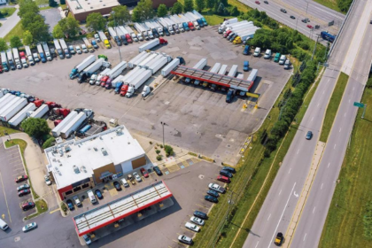 US truck parking crisis with semi-trucks at a crowded highway rest area